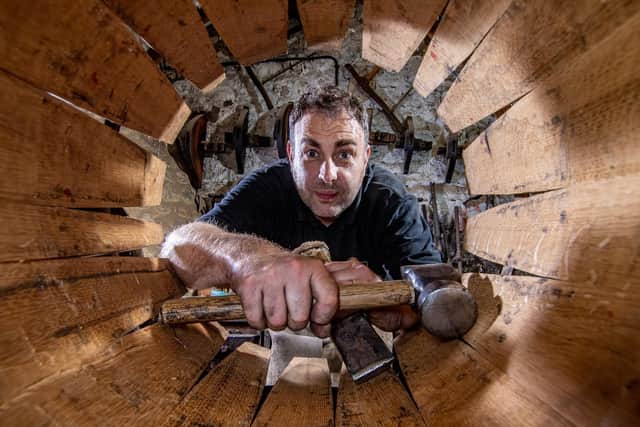 Master cooper Jonathan Manby tends to his casks. (Picture James Hardisty).