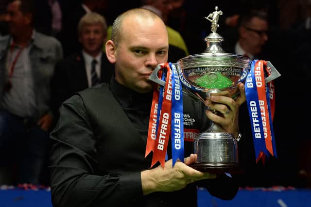 FIRST UP: Stuart Bingham celebrates winning the World Championships at the Crucible in May 2015. Picture: Anna Gowthorpe/PA