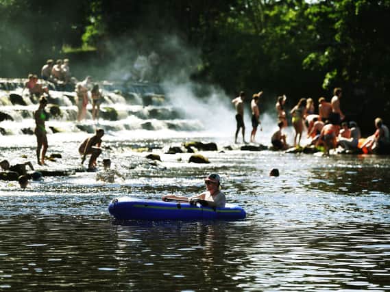 Revellers on the Wharfe at Burley in June