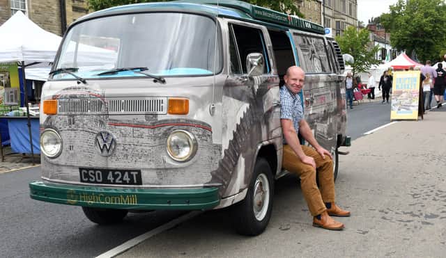 Andrew Mear, chairman of Skipton BID, with his VW camper van wrapped in Skipton images on Skipton High Street.