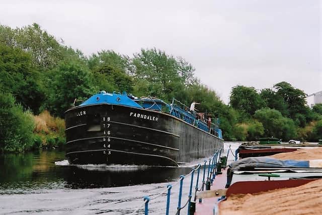 Branford Barge Owners Farndale H having unloaded at Lafarges Whitwood Depot , just about to pass a loaded Humber Renown on the River Calder section of the Aire and Calder Navigation Picture: Maik Brown