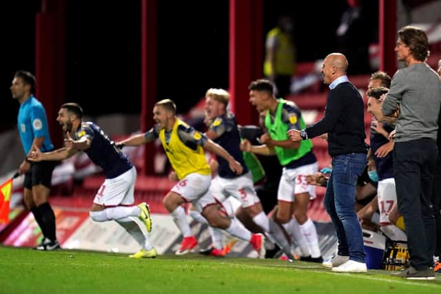 GREAT ESCAPE: Barnsley manager Gerhard Struber and his players celebrate at the final whistle at Brentford. Picture: John Walton/PA Wire.