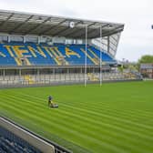 Ready to resume: Groundsman Ryan Golding cuts the grass at Headingley ahead of Super League returning. Picture: Tony Johnson