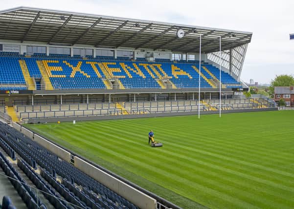 Ready to resume: Groundsman Ryan Golding cuts the grass at Headingley ahead of Super League returning. Picture: Tony Johnson
