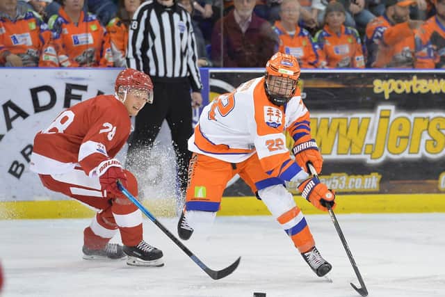 HIGH AMBITIONS: Defenceman Jordan Griffin, right, in action for Sheffield Steelers. Picture courtesy of Dean Woolley.