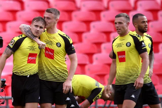 Harrogate Town's Jack Diamond (left) celebrates scoring his side's third goal of the game with team-mates. Picture: Adam Davy/PA