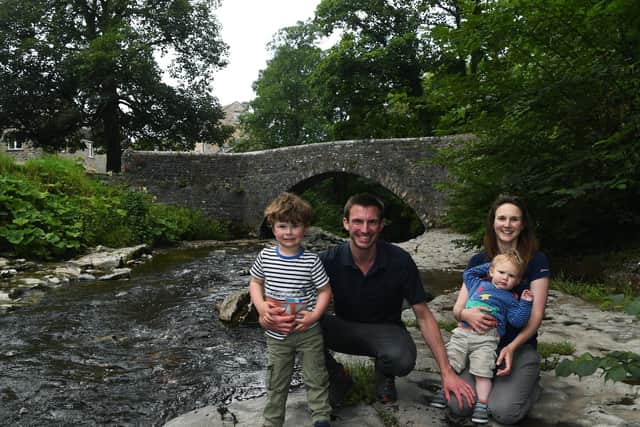 Matt and Helen Coppin from West Burton are combining their knowledge of the Yorkshire Dales and love of hiking to run a new self-guided walking holiday company called Muddy Boots Walking Holidays. Pictured with their sons Ed, three, and Tom, one. Picture: Jonathan Gawthorpe