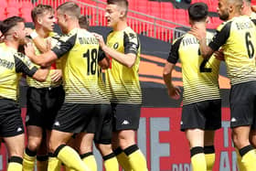 Harrogate Town's players celebrate after taking an early lead at Wembley Stadium. Picture: Getty Images