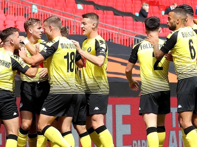 Harrogate Town's players celebrate after taking an early lead at Wembley Stadium. Picture: Getty Images