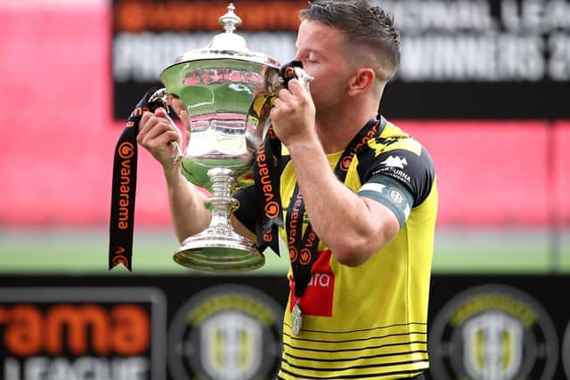 Harrogate Town's Josh Falkingham with the trophy after the final whistle during the Vanarama National League play-off final at Wembley Stadium, (Picture: Adam Davy/PA Wire)