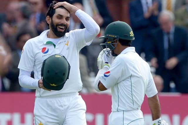 Pakistan's Misbah-Ul-Haq (left) celebrates scoring 100 not out during day one of the Investec Test match at Lord's, London. PRESS ASSOCIATION Photo. Picture date: Thursday July 14, 2016. See PA story CRICKET England. Photo credit should read: Anthony Devlin/PA Wire. RESTRICTIONS: Editorial use only. No commercial use without prior written consent of the ECB. Still image use only. No moving images to emulate broadcast. No removing or obscuring of sponsor logos. Call +44 (0)1158 447447 for further information.
