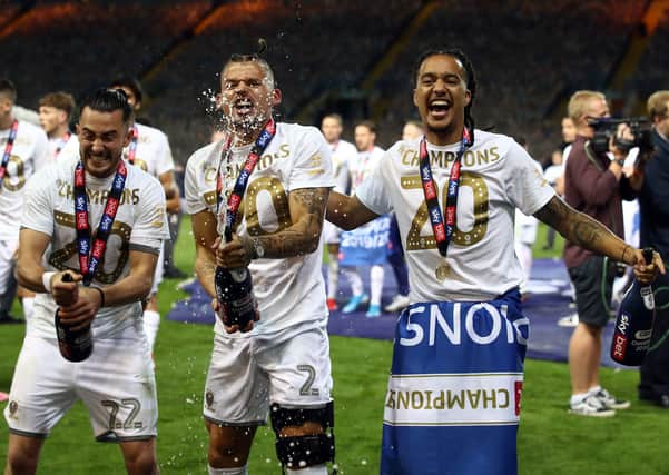 Leeds United's Jack Harrison, Kalvin Phillips and Helder Costa (left-right) celebrate promotion. Picture: PA