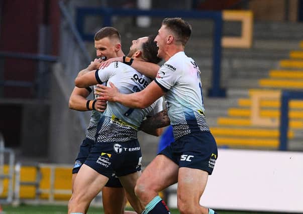 02 August 2020. Picture James Hardisty.
Huddersfield Giants v Leeds Rhino's, in the Betfred Super League match held at Emerald Headingley Stadium, Leeds. Pictured Luke Gale, of Leeds Rhinos, celebrates with his teammates after his drop kick wins the match for Leeds Rhino's.
