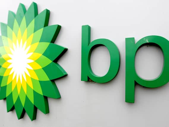Oil giant BP slashed its dividend in half as it swung to a multi-billion dollar loss in the second quarter of the year as the Covid-19 pandemic pushed down oil prices.