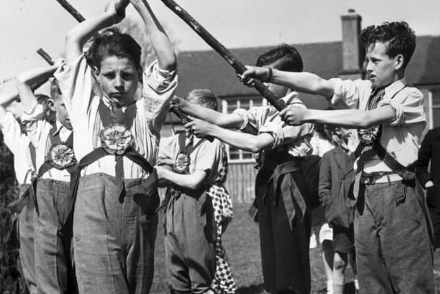 9th May 1942:  Boys at Helstead Village School in Kent practice English folk dancing.  (Photo by Harry Shepherd/Fox Photos/Getty Images)