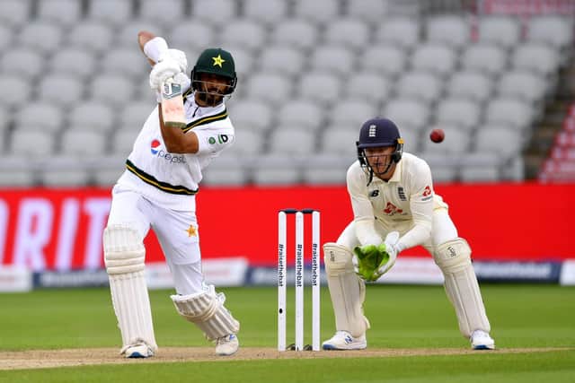 Pakistan's Shan Masood drives through the off side on day one of the Test match at Old Trafford. Picture: Dan Mullan/NMC Pool/PA.