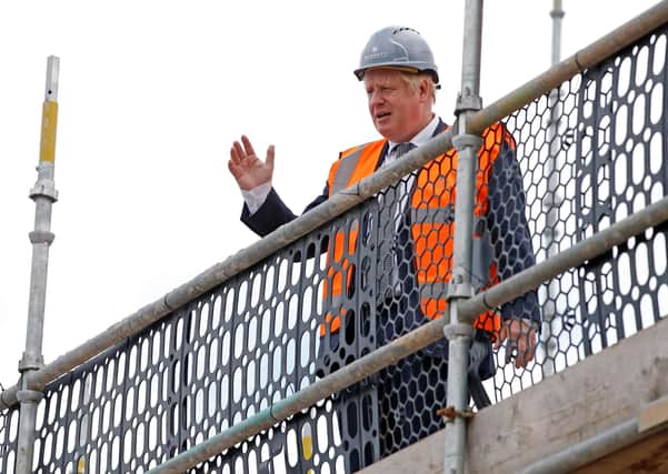 Boris Johnson visited a building site on the day the Government announced moves to relax planning rules.