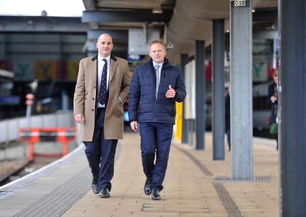 Jake Berry (left) was the original Northern Powerhouse Minister in the Cabinet before being replaced by Transport Secretary Grant Shapps (right). They are pictured at Leeds Station earlier this year.