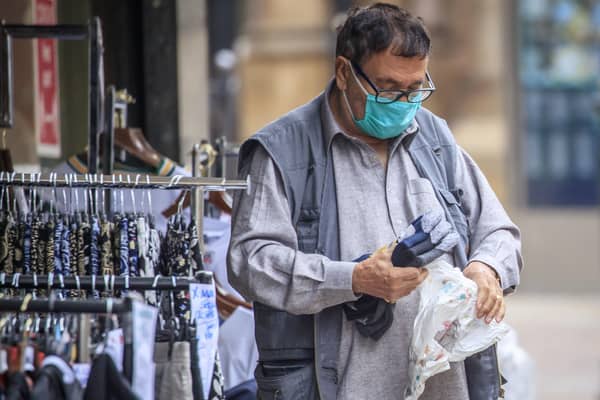 A member of the public wears a face mask in, Bradford in Yorkshire, after Health Secretary Matt Hancock published a new review which found black, Asian and minority ethnic (BAME) people are at significantly higher risk of dying from Covid-19.