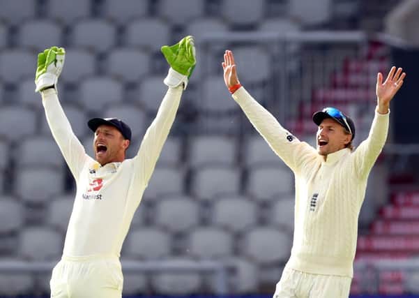 Stand by me: England wicketkeeper Jos Buttler and captain Joe Root. Picture: Michael Steele/NMC Pool/PA