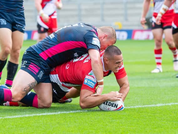 Picture by Allan McKenzie/SWpix.com - 09/08/2020 - Rugby League - Betfred Super League - Salford Red Devils v Hull FC - Emerald Headingley Stadium, Leeds, England - Hull FC's Josh Jones can't prevent Salford's Tui Lolohea from scoring a try.
