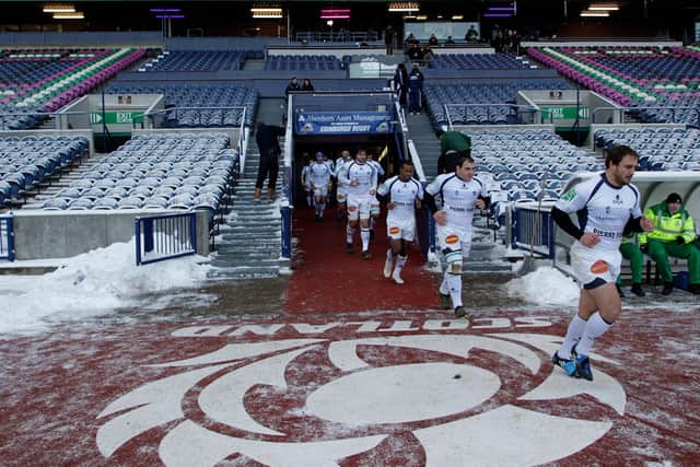 Players from the French rugby club Castres, run onto the pitch for their Heineken Cup, pool one, rugby union match against Scottish team Edinburgh, at an empty Murrayfield Stadium in Edinburgh (Picture: Graham Stuart/AFP via Getty Images)
