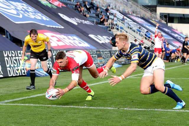 St Helens' Tommy Makinson (centre) scores his side's third try. Pictures: PA
