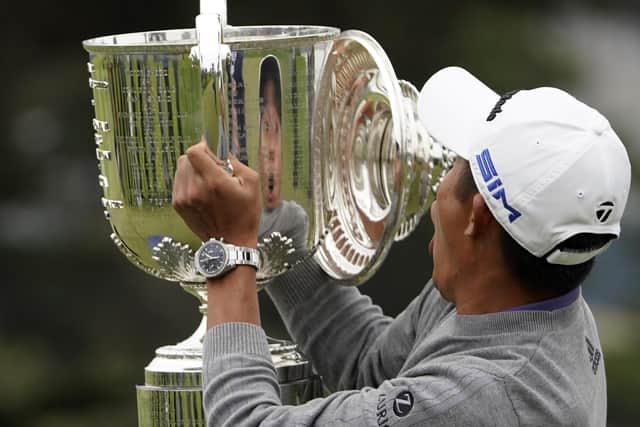 Oops: Collin Morikawa reacts as the top of the Wanamaker Trophy falls.