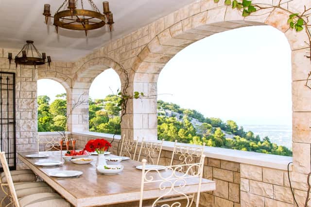 The villa's wraparound dining terrace. Photo: Maria Boyle
