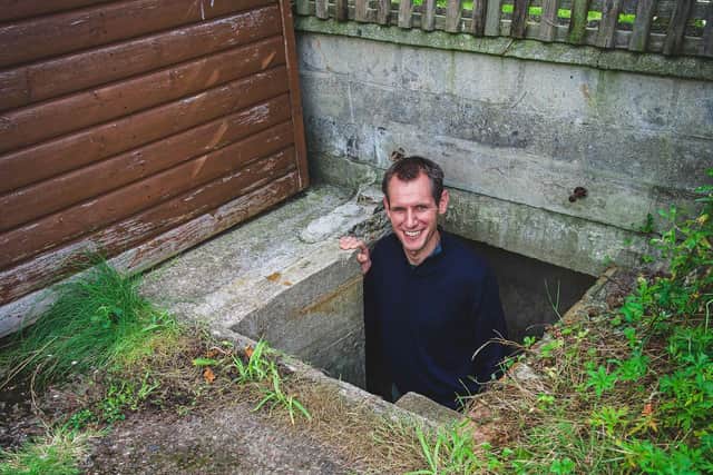 James Fox in the air raid shelter found in his garden in York