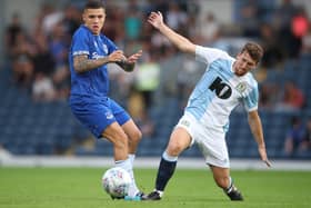 Hull leader: Everton's Muhamed Besic battles with new Tigers signing and former Blackburn Rovers player Richie Smallwood. Picture: PA
