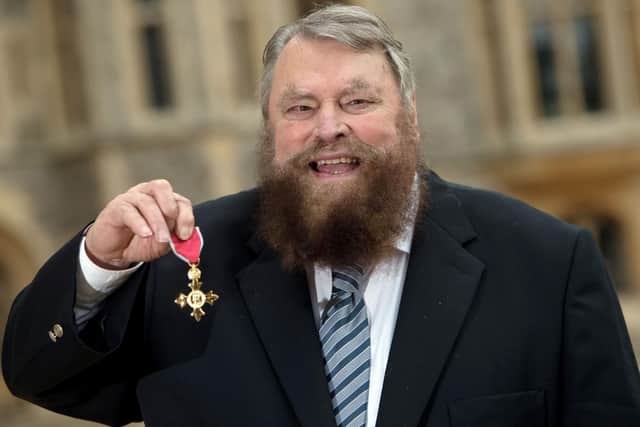 British actor Brian Blessed poses with his medal after being appointed an OBE, by the Queen at Windsor Castle on October 7, 2016. Picture: STEVE PARSONS/AFP via Getty Images)