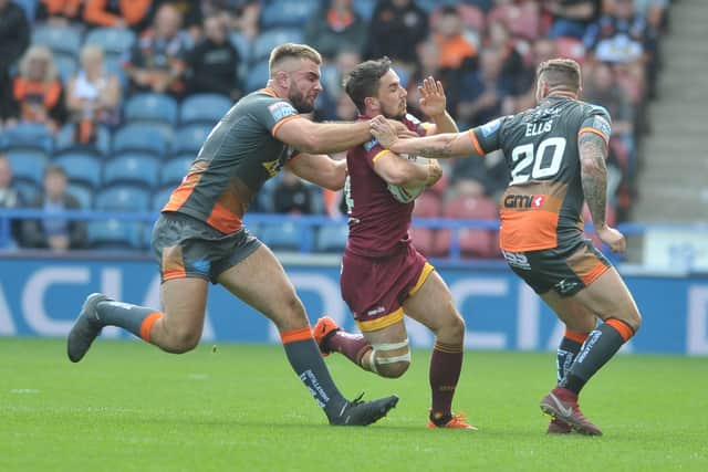 18 August 2019......     Huddersfield Giants v Castleford Tigers Super League.
Giants Tom Holmes tackled by Tigers Mike McMeeken and Jamie Ellis. Picture Tony Johnson.