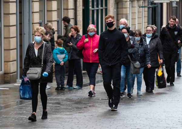 Face coverings are compulsory in England in shops and supermarkets. Photo: Kelvin Stuttard