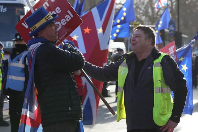 A leave supporter argues with a remain supporter outside Parliament in January 2019. Picture: Jonathan Brady/PA Wire