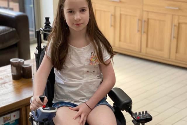 Amelia in her wheelchair.