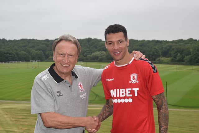 IMPROVEMENT: Neil Warnock with Marvin Johnson (right), who has signed a new one-year contract