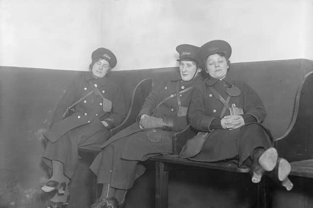 February 1916:  Between shifts women bus conductors take a nap on their 'desks'.  (Photo by Topical Press Agency/Getty Images)