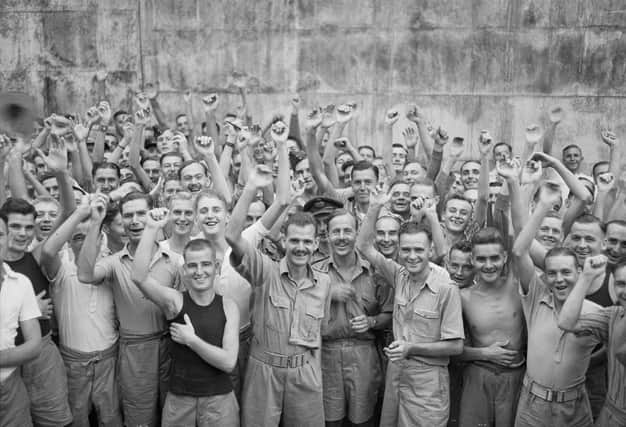 Allied prisoners of war celebrating their liberation from Changi Jail, Singapore.