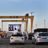 Moviegoers watch Grease on the big screen in the Titanic Quarter beneath the famous Harland and Wolff cranes in Belfast earlier this summer. (Getty Images).