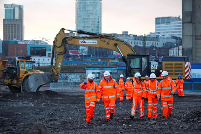 Britain's Prime Minister Boris Johnson walks with apprentices during his visit to Curzon Street railway station in Birmingham, central England on February 11, 2020, where the High Speed 2 (HS2) rail project is under construction. (Photo by EDDIE KEOGH/POOL/AFP via Getty Images)