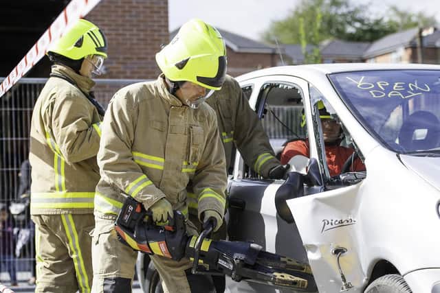 Fire fighters cutting into a vehicle during rescue training at Dewsbury Fire Station