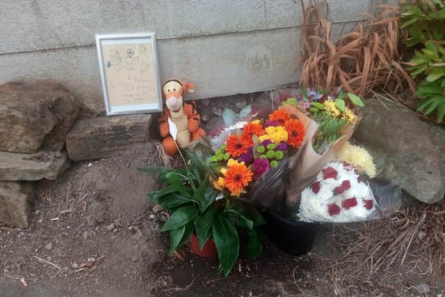 Flowers at the scene of Kavan Brissett's murder at Langsett Walk, Sheffield