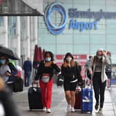 Library image of passengers arriving at Birmingham Airport, as people arriving into England from holidays in Spain have been told they must quarantine when they return home.