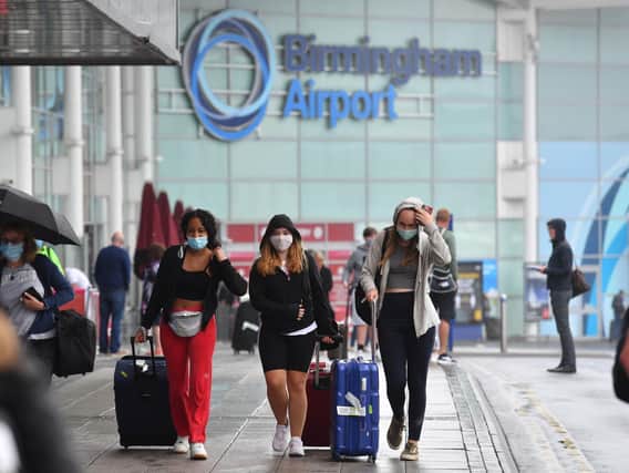 Library image of passengers arriving at Birmingham Airport, as people arriving into England from holidays in Spain have been told they must quarantine when they return home.