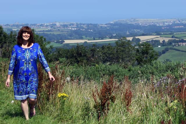 Pictured, teacher Joanne Cassell-Osowski at the top of Blue Bank near Sleights where she now lives with a backdrop of Whitby where she has relocated to fro Barnsley, as part of a teacher recruitment by the North Yorkshire Coast opportunity area.  Photo credit: Gary Longbottom/ JPIMediaResell