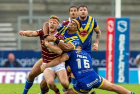 Huddersfield Giants' Adam O'Brien feels the pain from a high tackle. (PIC: Bruce Rollinson/JPIMedia)