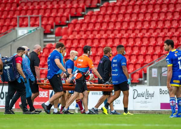 Giants blow: Matty English is carried off following injury against  Warrington Wolves. Picture: Bruce Rollinson
