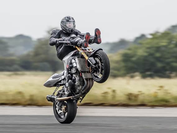 Jonny Davies attempting a new world record for the fastest motorbike handlebar wheelie during the Motorcycle Wheelie World Championship Picture: Danny Lawson/PA Wire