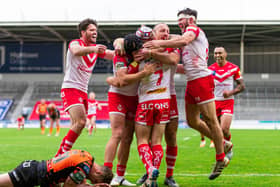 St Helens' Theo Fages celebrates his try with team-mates.